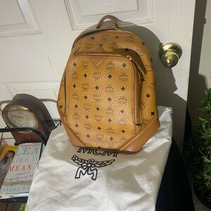 MCM small Cognac back pack with storage bag.